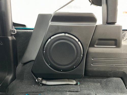 Loaded subwoofer enclosure installed in a Jeep Wrangler JL with non-Alpine audio